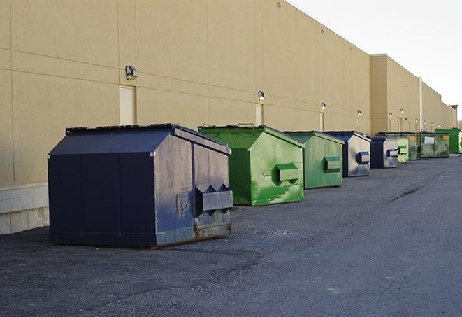 a collection of bright and vibrant dumpsters in a construction zone in Elburn IL